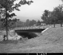 Completed Concrete and Steel Bridge Construction over Black River in Ludlow, Looking Westerly from Grassy Area