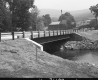 Completed Concrete and Steel Bridge Construction over Black River in Ludlow, Looking Easterly from Grassy Area