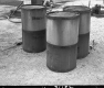 Barrels in Barre at Construction Site with Machinery