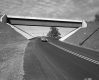 Car on Road Past Bridge