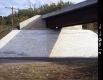 Brick Slope Beneath Bridge