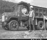 Sandy Wood, Flag Person at Construction Site in Barnet, Girl Behind Large Dump Truck