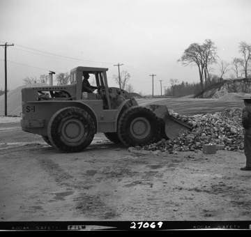 Front Loader Moving Bottles