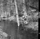 Girl Cleaning by Creek