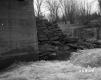 Stone Wall by River and Bridge