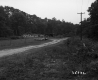 House and Fence by Road