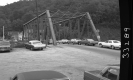 Cars on Steel Truss Bridge