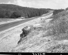 Grassy Slope by Paved Road