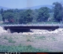 Completed Bridge Construction Over Small River With Dwelling (Color)