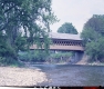 View of Middle Bridge from Banks of River (Color)