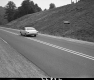 Car on Road with Sign
