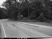Sign by Paved Road
