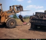 Tractor and Truck at Car Crushing Area