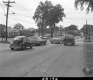 Cars on Paved Road in Town