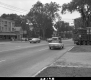 Cars and Logging Truck on Paved Road