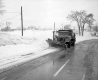 Snow Plows on Snowy Road