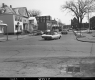 Cars on Road with Houses