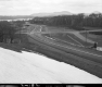 Snow on Hill Above Road