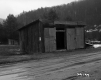 Wooden Shed by Dirt Road