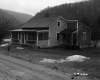 House by Muddy Road