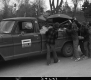 Children Picking up Trash From Back of Truck, Clean Up Day