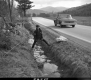 Green Up Day on US Route 2 in Marshfield, Kid Standing on Trough