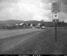 Traffic Stop on Green Up Day on VT Route 18 in Waterford, Dwellings and Farm in Background