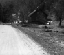 Small Wooden Dwelling off of Unpaved Road in Plymouth