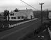House with Fence by Road