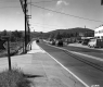 Cars on Road near Stores