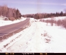 Snow by Paved Road