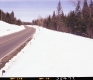 Snow by Paved Road