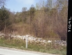 Stone Wall by Paved Road