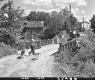 Boy Walking on Bridge