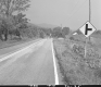 Sign by Paved Road
