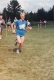 A group of runners traversing a field