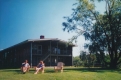 A man and women sit outside Cedar Lodge