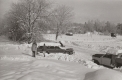 Cars Parked Along a Snowy Road