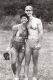 A woman and a man standing together in a field