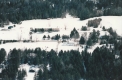 Aerial of Craftsbury Outdoor Center from above lake